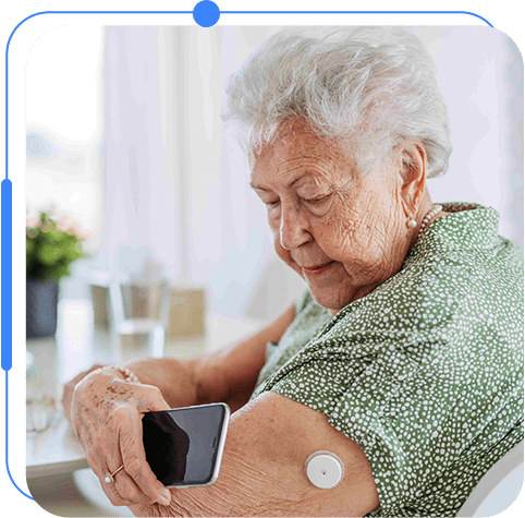 An older woman is using a smart phone.
