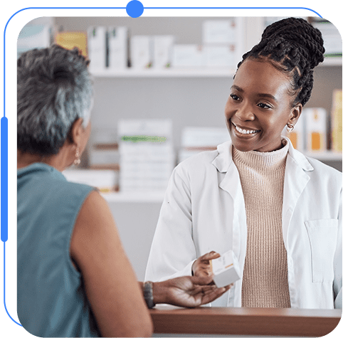 A woman is talking to someone in the pharmacy.